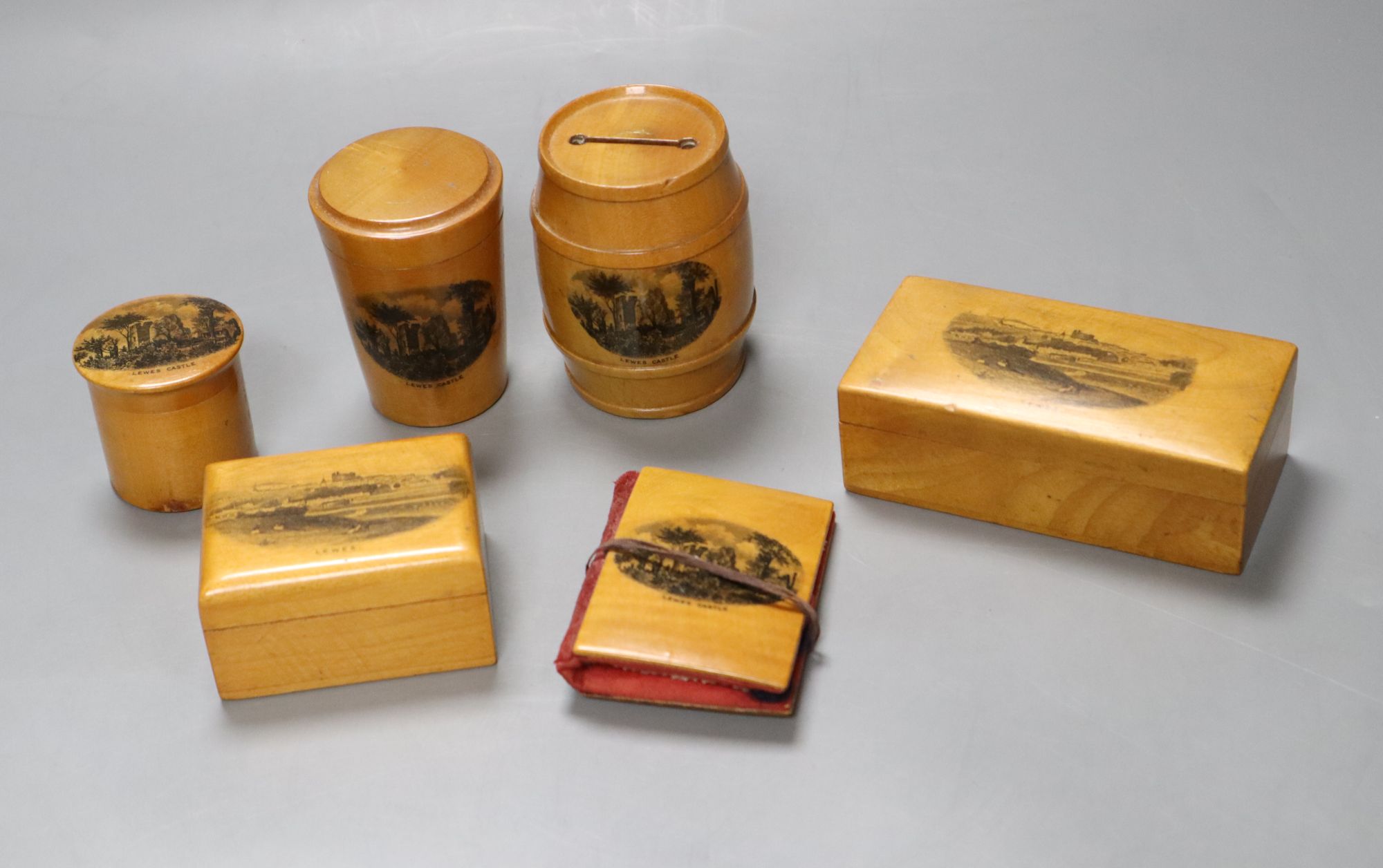 Six pieces of Mauchline ware including a money box, height 8cm